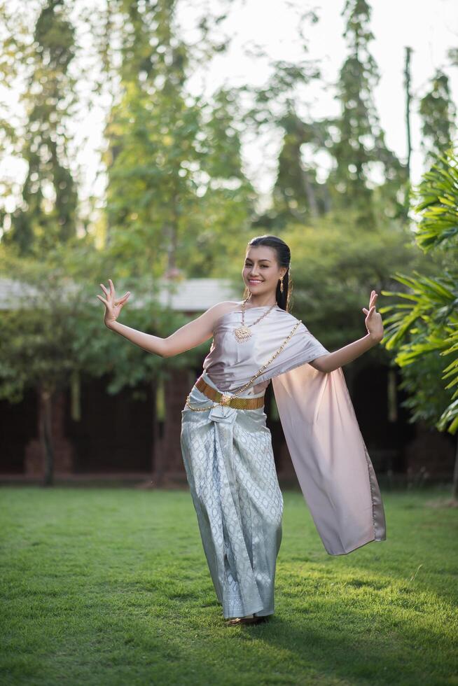 Beautiful Woman wearing typical Thai dress photo