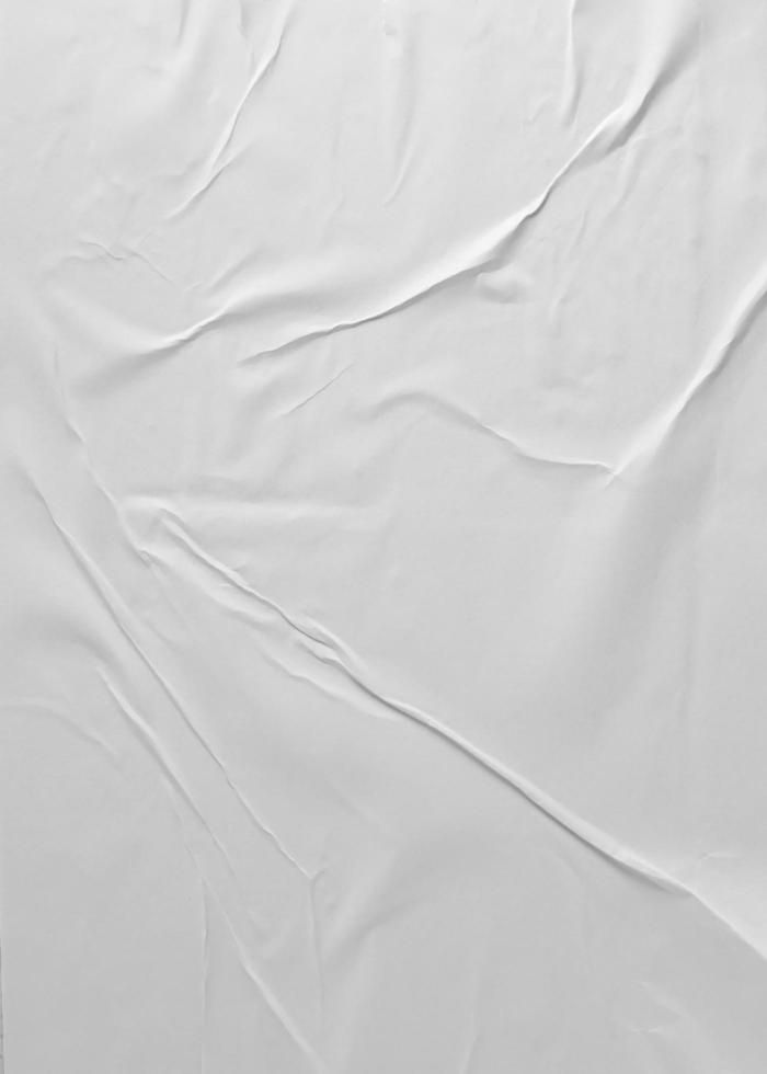 Glued paper for poster texture. Blank white crumpled and wrinkled paper template for background. Matted wet paper wrinkled for mockup posters. photo