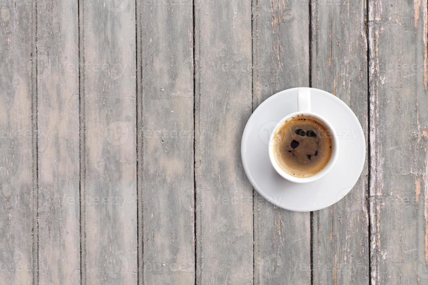 Top up view black espresso on dark wooden vintage table . added copy space for text , suitable for your food or drink concept background. photo