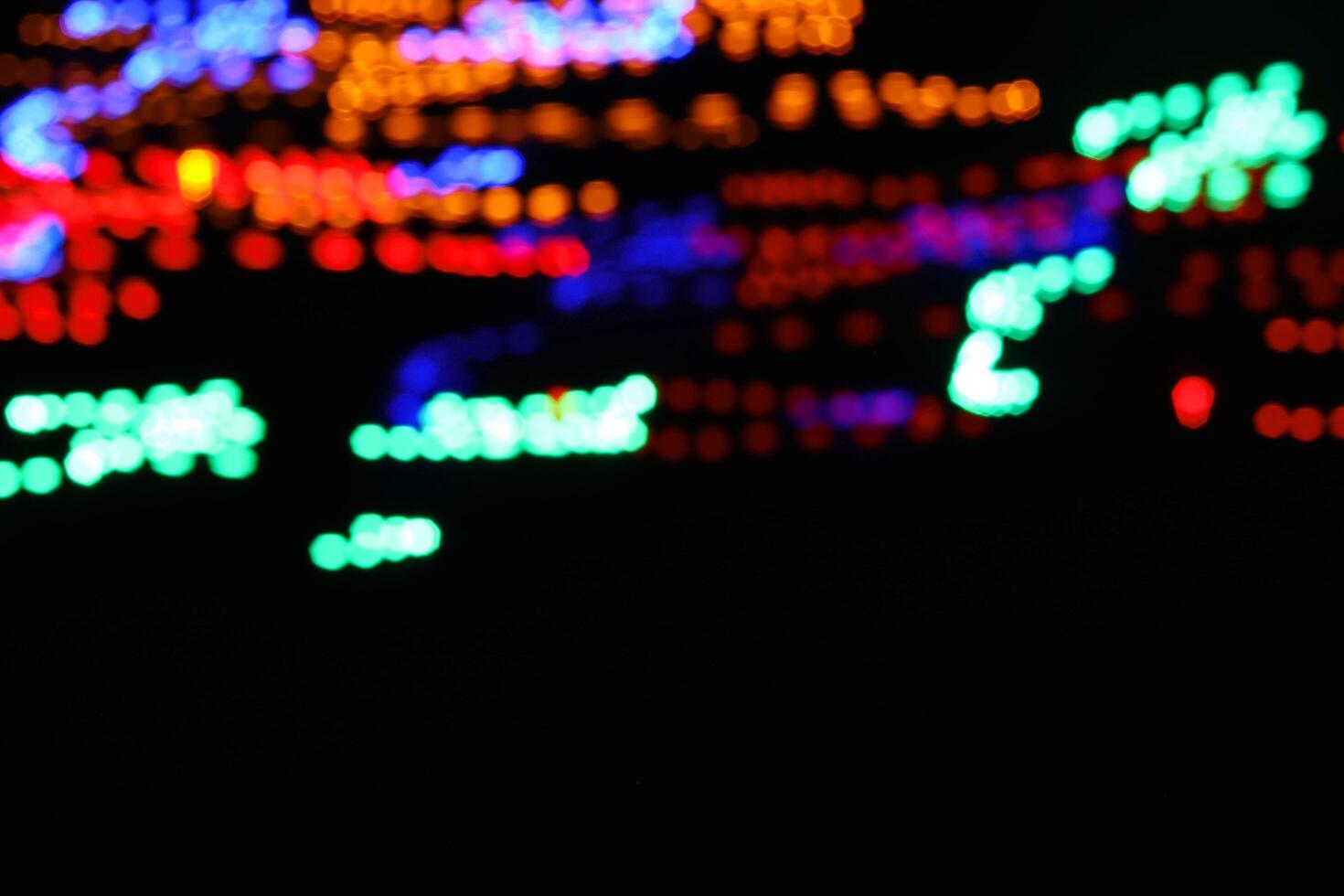 abstract circle line blue and green and orange urban realistic blurred glitter light colorful texture on black. photo