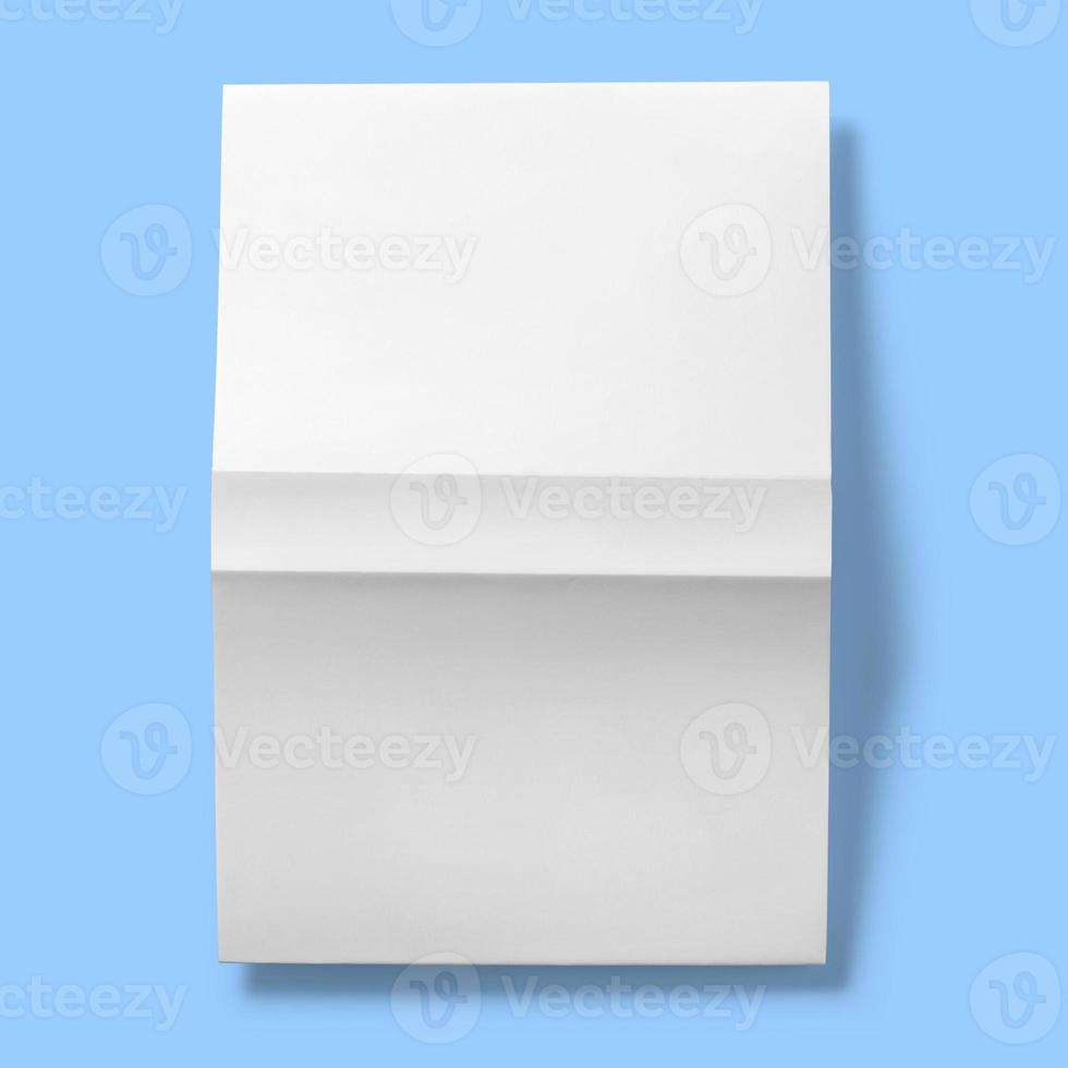 Back to school concept , hard cover blank white upside down open isolated on blue photo