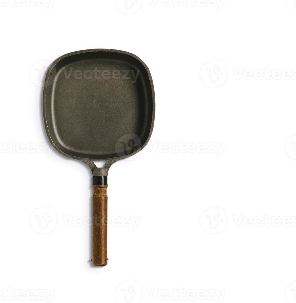 Close up of isolated frying pan against white background. fix with your project element. photo