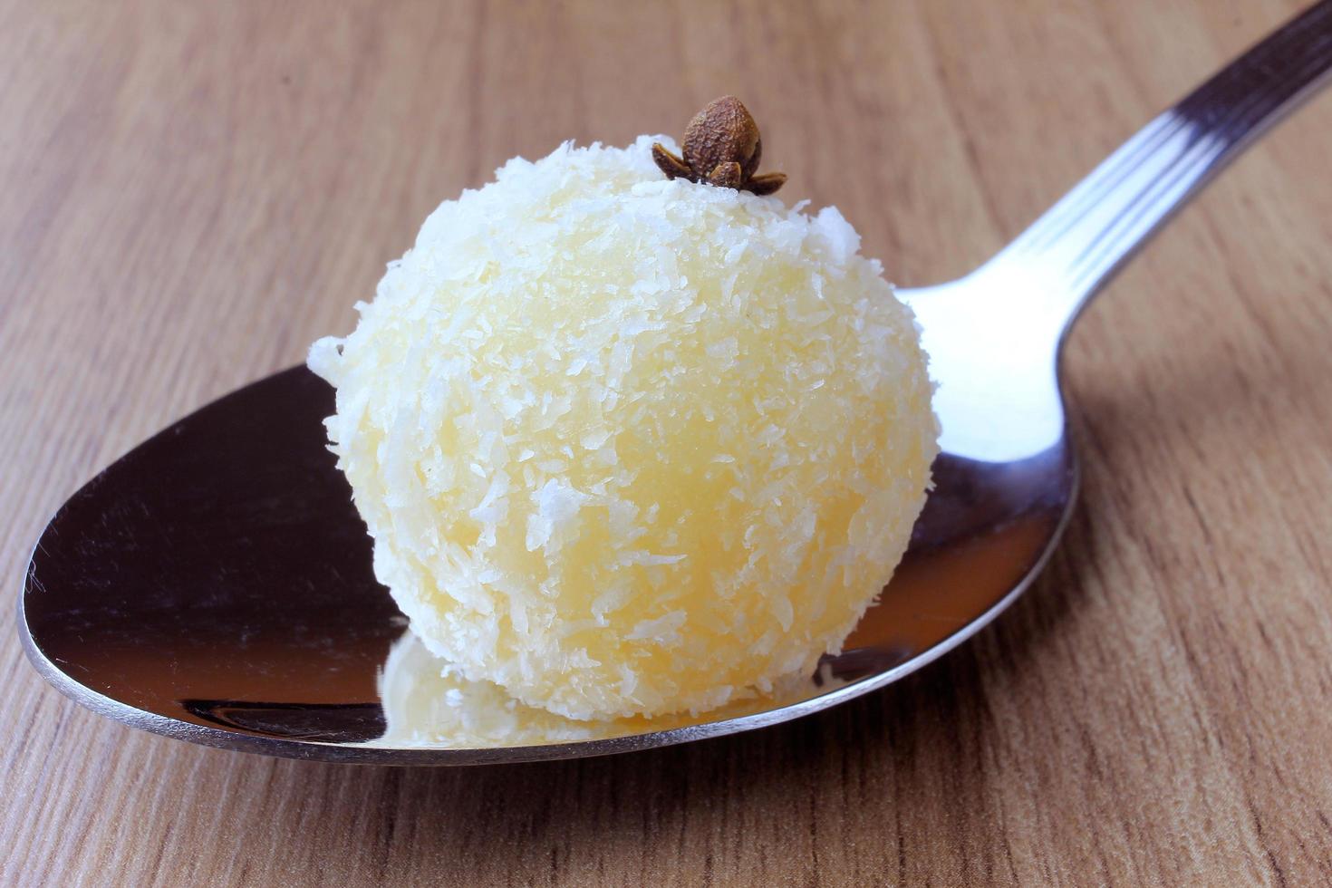 coconut kiss - beijinho de coco - typical sweet Brazilian cuisine isolated on white background photo