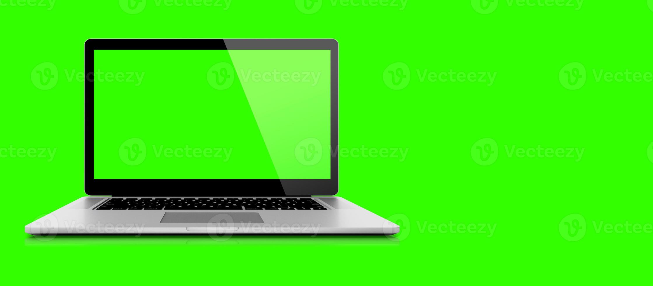 Mockup image of 3D rendering White laptop or notebook pc with blank green  screen on green background. suitable for your design element. photo