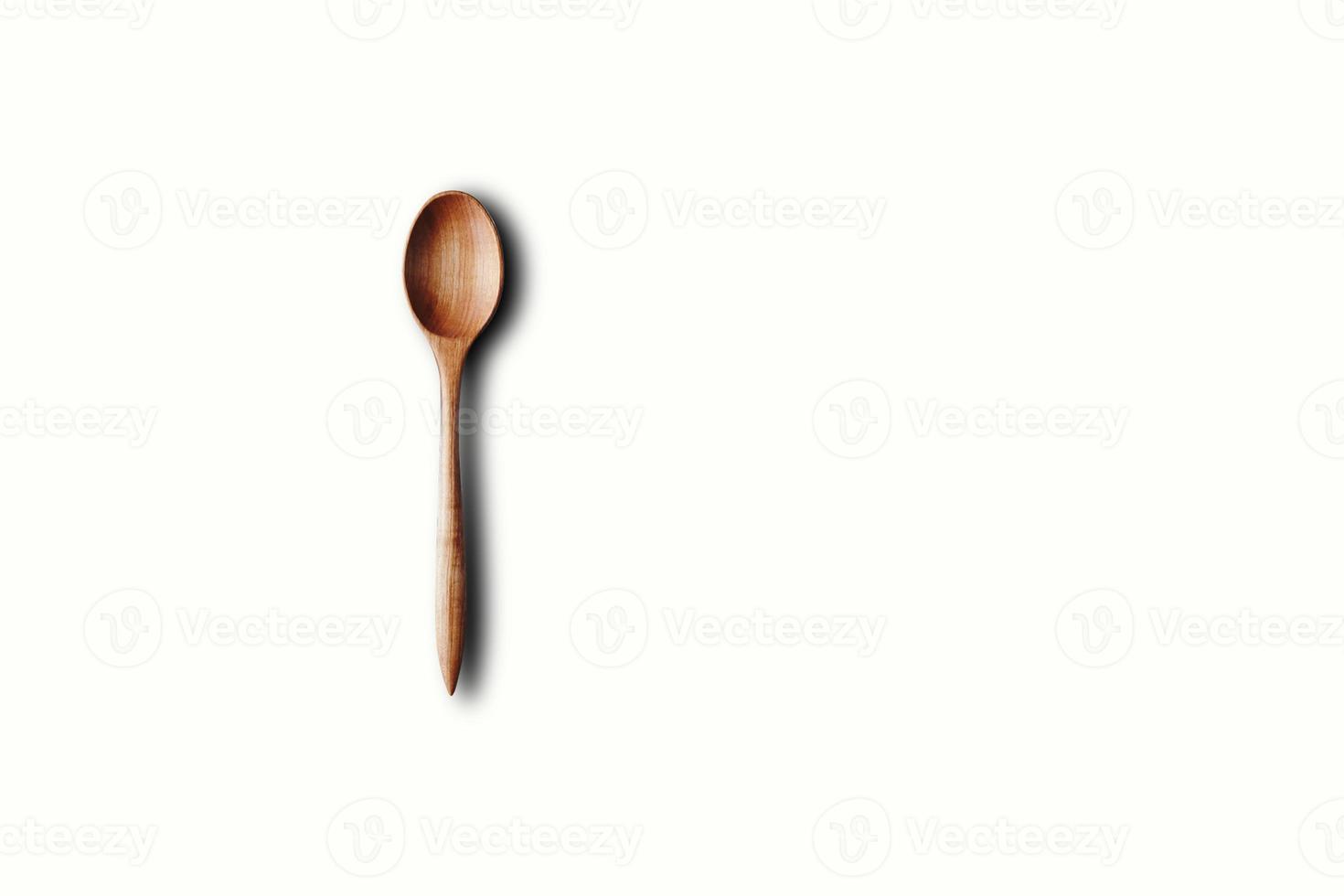 Directly Above View Of Wooden Spoon Against White Background photo