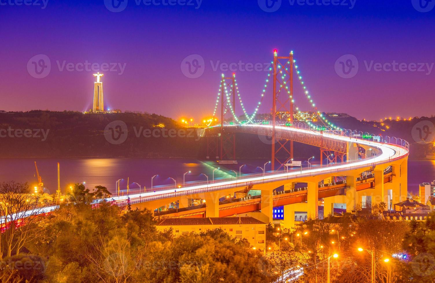 The 25th April Bridge Ponte 25 de Abril at night. Lisbon, Portugal. photo