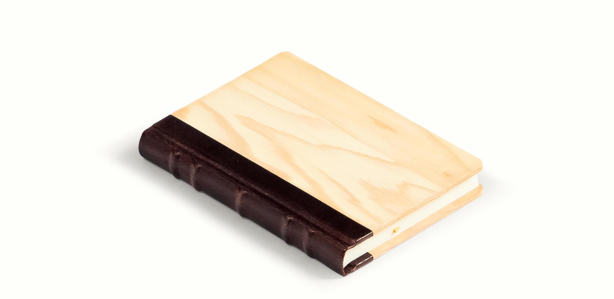 Top up view of book with wooden style cover isolated . fit for your design element. photo