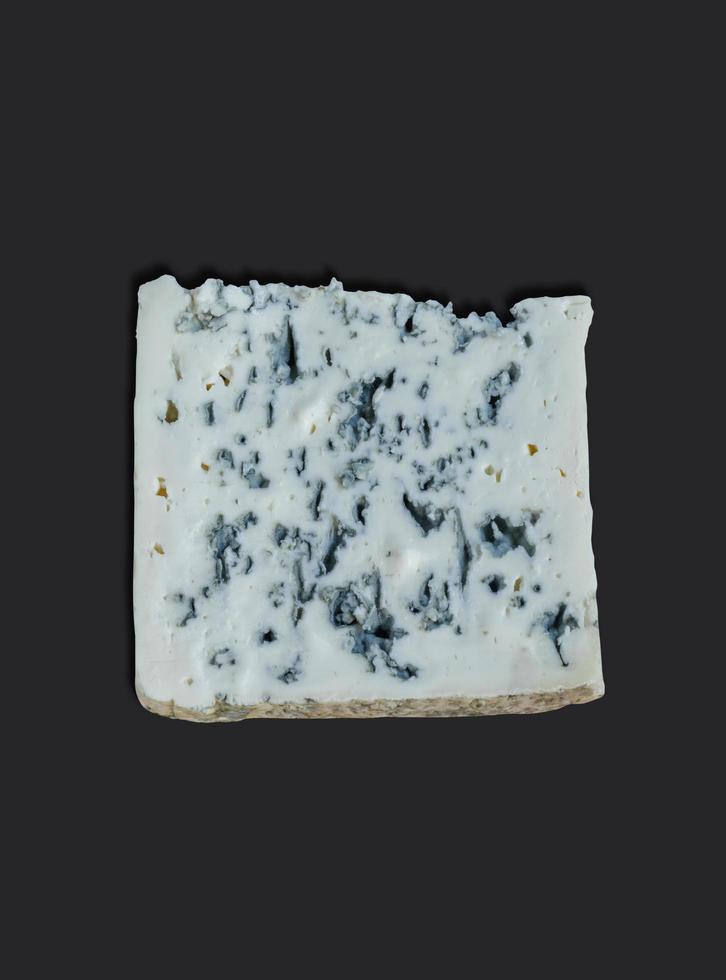 French Cheese called Roquefort, Cheese made from Ewe's Milk isolated on black background. photo