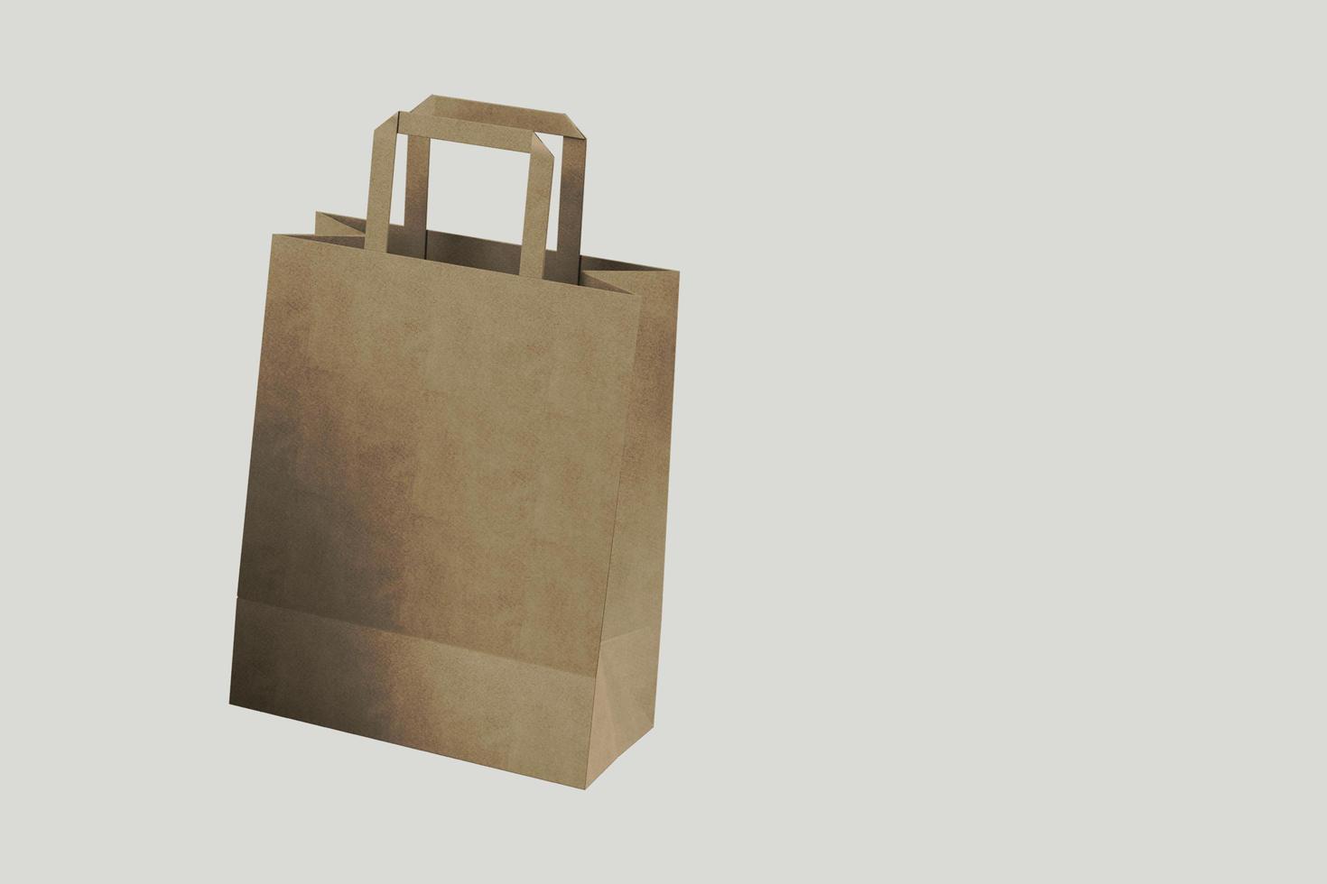 Close up view of Shopping bag from craft paper with handles on white background , 3d Rendering isolated illustration. suitable for your element design. photo