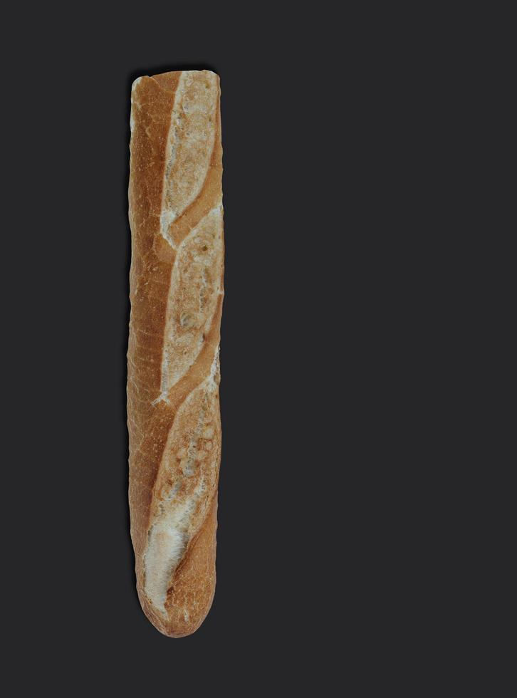 Crunchy french baguette, on black background with copy space for text photo