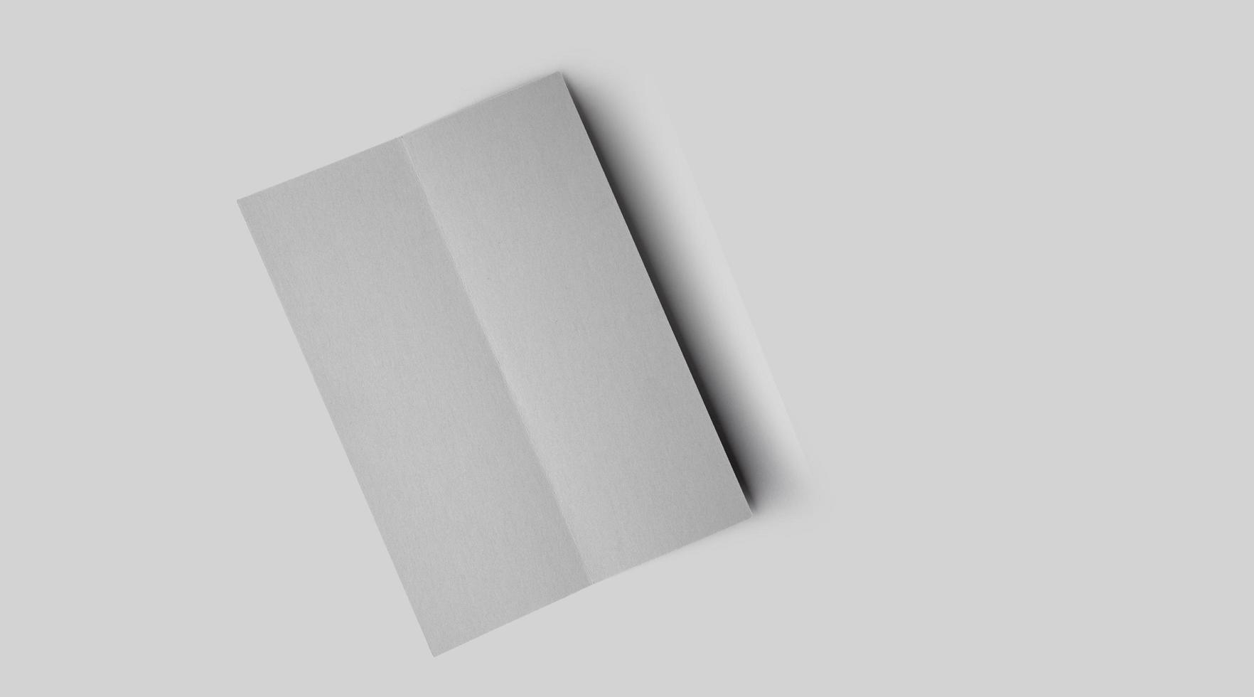 Empty white vertical rectangle price-list or menu mockup with soft shadows on neutral grey concrete background. photo