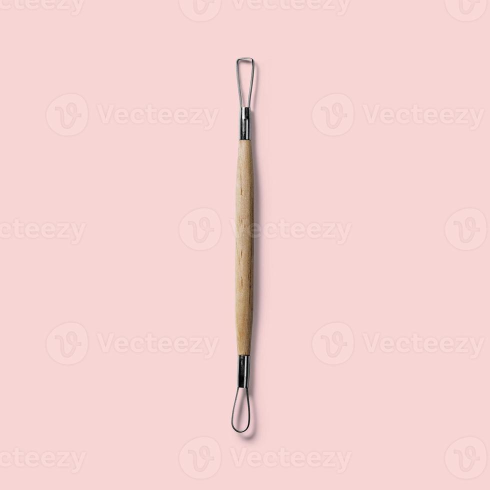 Close up view of pottery tool isolated on pink background. fit for your design element. photo