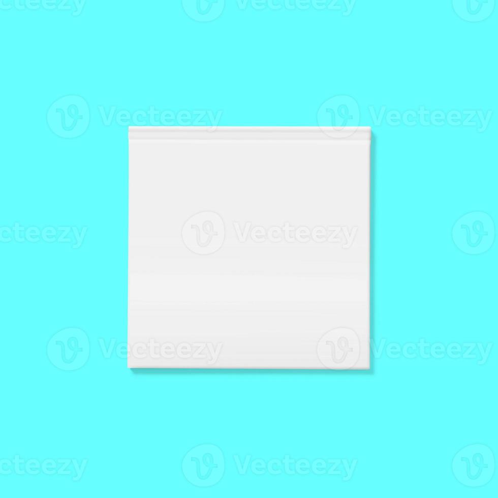 Back to school concept - Top view of blank hard cover book front close on tosca background desk for mockup photo