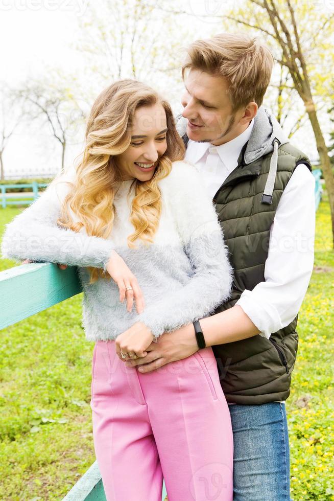 White couple hugging close-up portrait outdoor vertical image photo