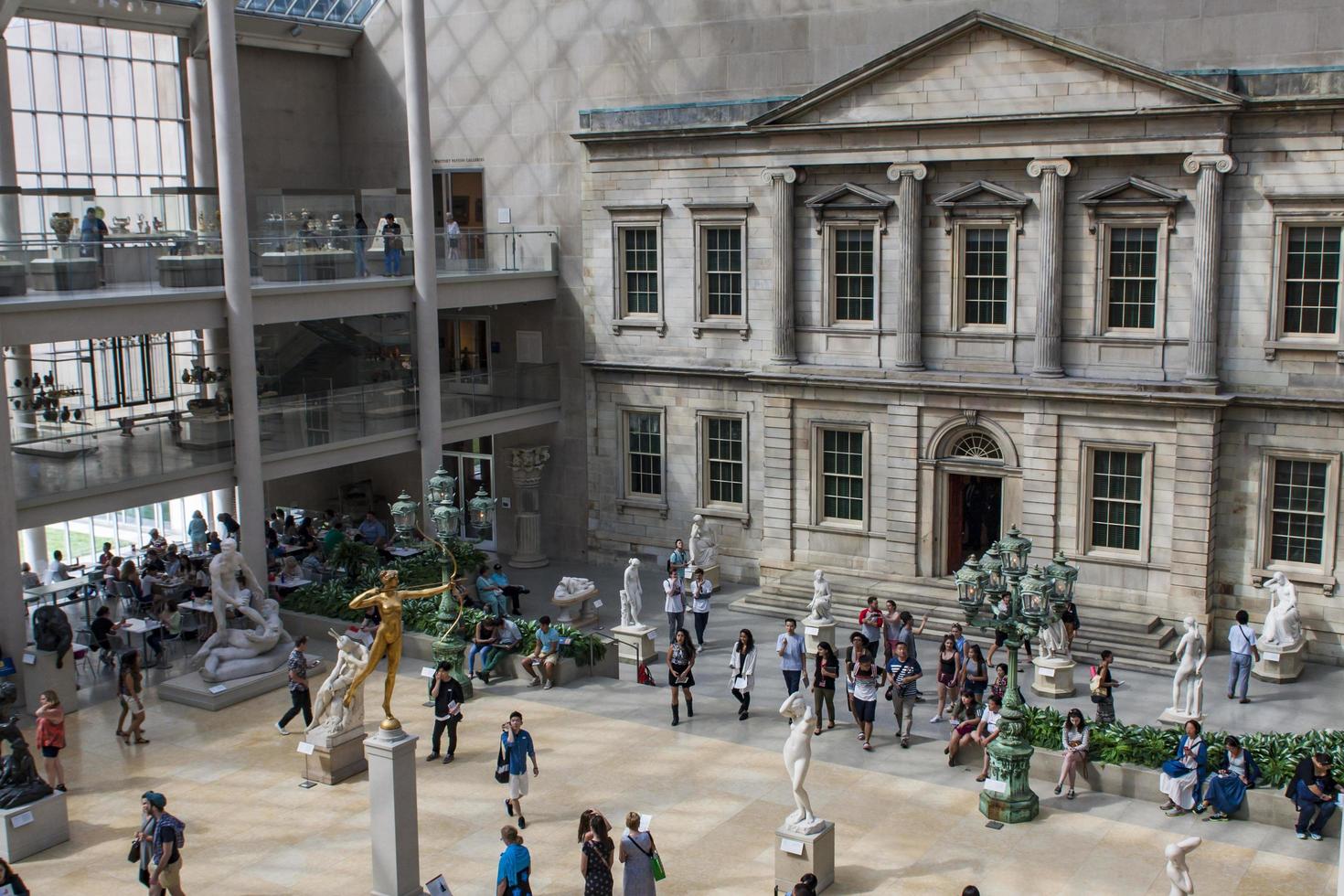 NEW YORK, USA, AUGUST 5, 2016 - Unidentified people at Metropolitan Museum of Art in New York. Museum was founded at 1870 and today is the largest art museum in the United States photo