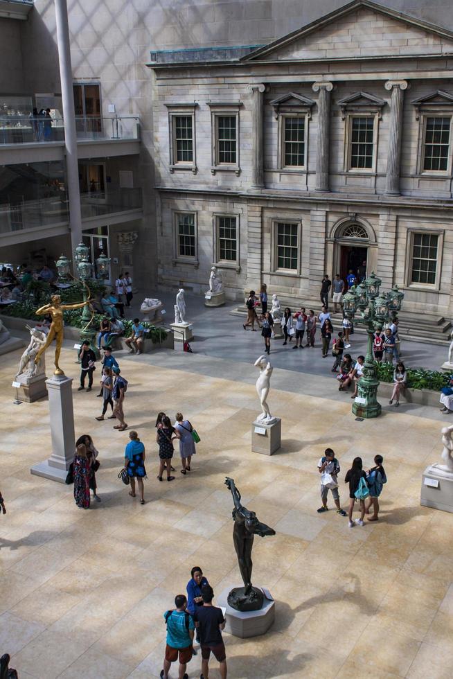 NEW YORK, USA, AUGUST 5, 2016 - Unidentified people at Metropolitan Museum of Art in New York. Museum was founded at 1870 and today is the largest art museum in the United States photo