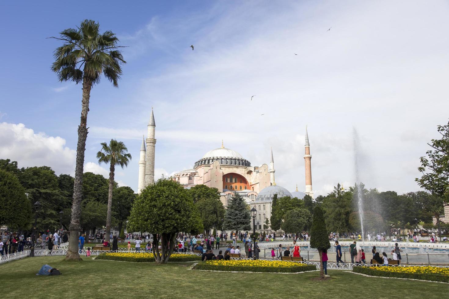 ISTANBUL, TURKEY, JUNE 15, 2019 - Unidentified people in front of Hagia Sophia in Istanbul, Turkey. For almost 500 years, Hagia Sophia served as a model for many other Ottoman mosques. photo