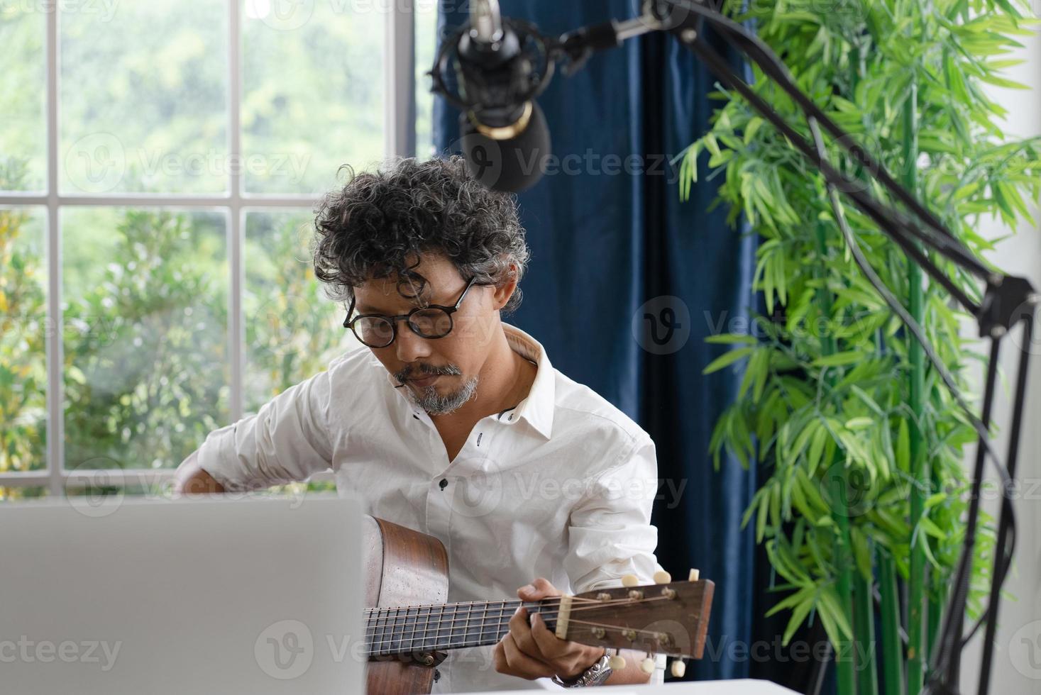 Musician Playing live Guitar at home photo