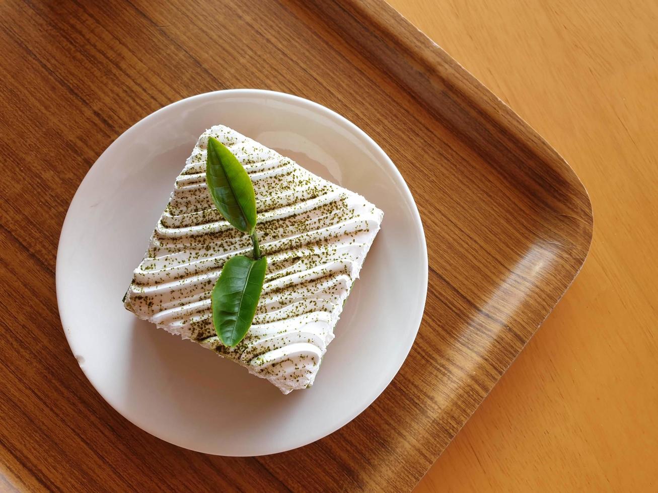green tea cake on the white plate photo