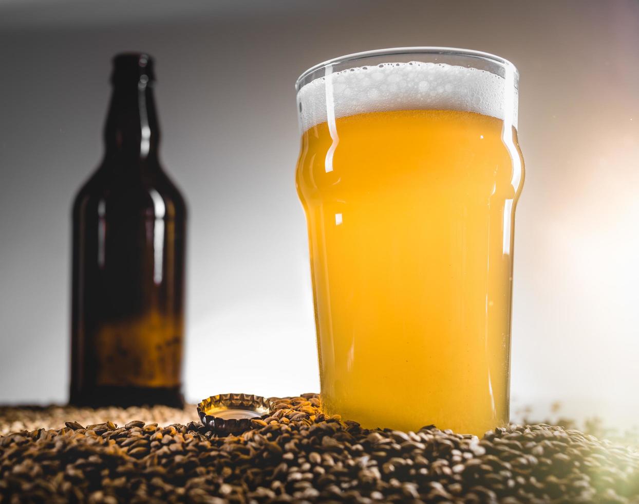 Homebrew Blond Beer on Pilsner Grain Heap photo