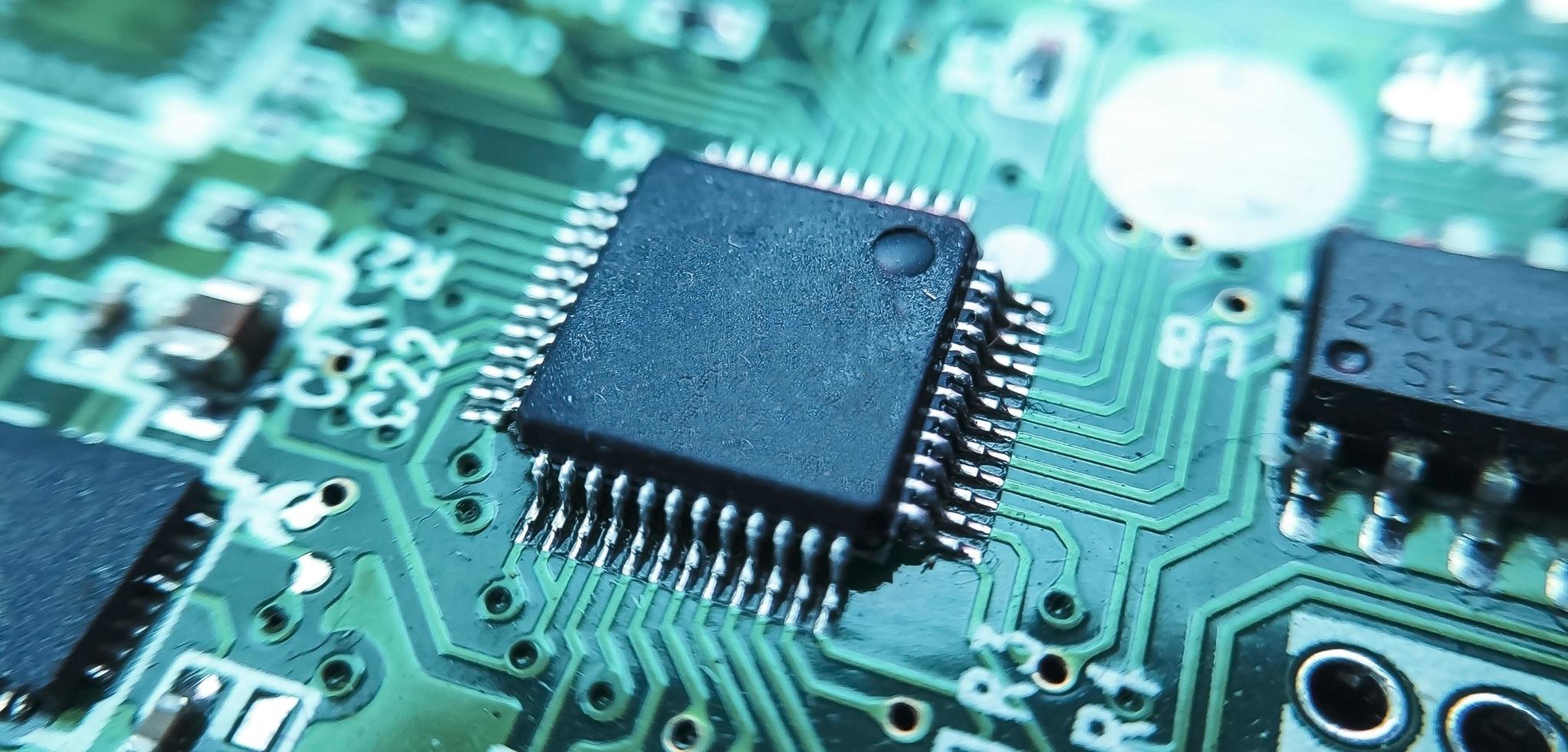 Close up image of microchip. Integrated circuit IC macro photograph. photo