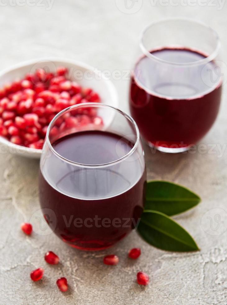 Pomegranate juice with fresh pomegranate fruits photo