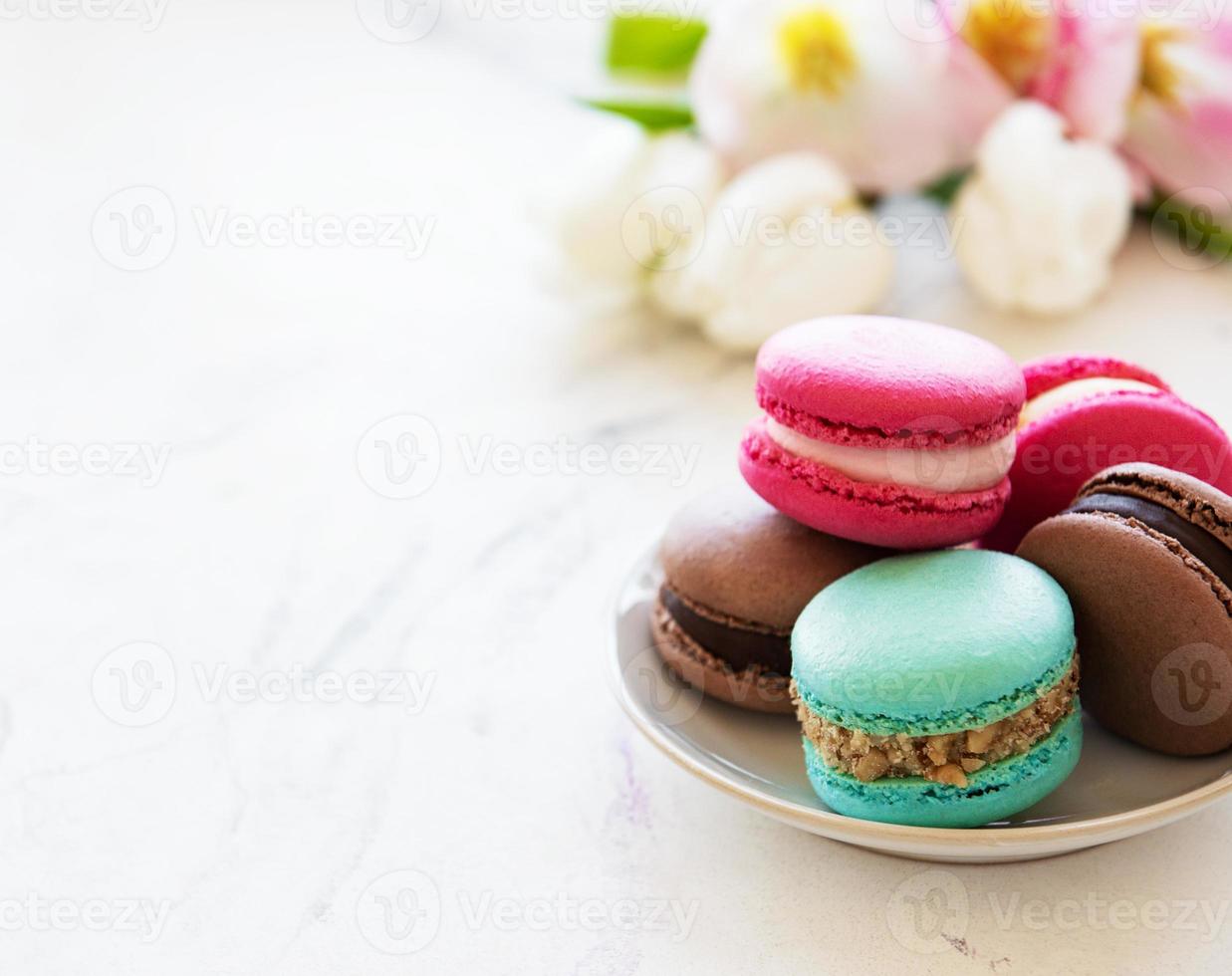 Colorful macaroons and tulips photo