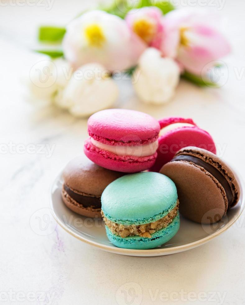 Colorful macaroons and tulips photo
