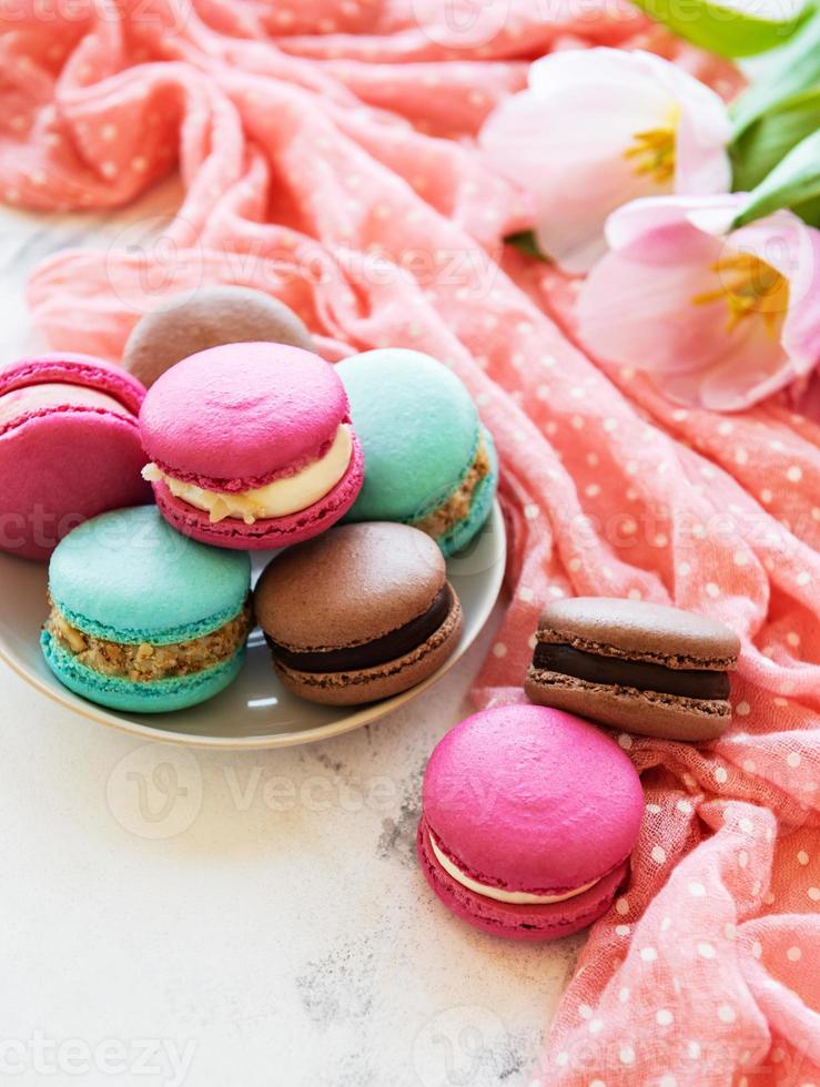 Colorful macaroons and tulips photo