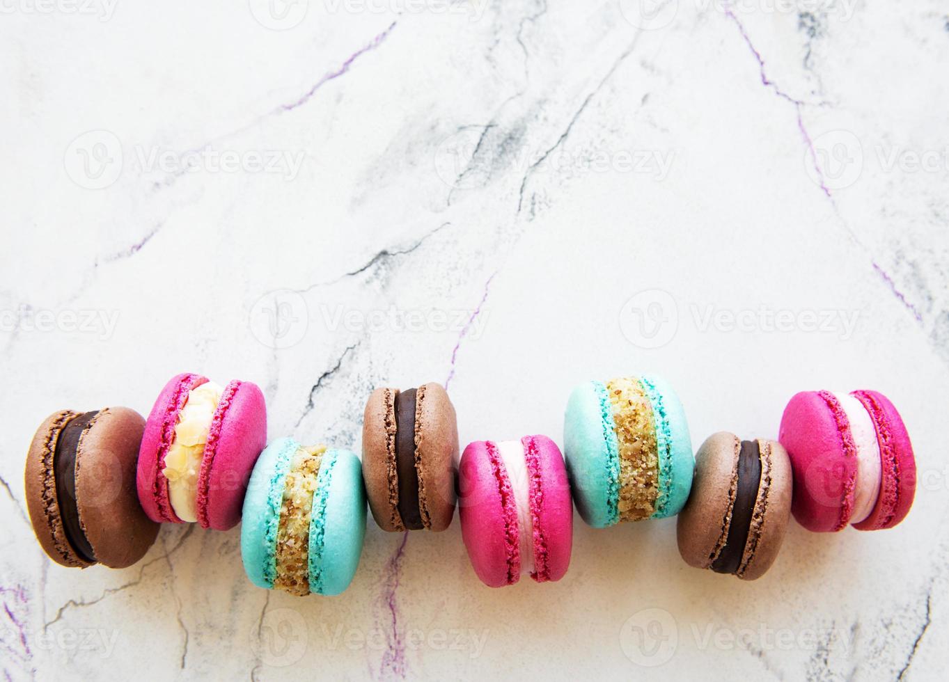 Colorful macaroons on marble photo