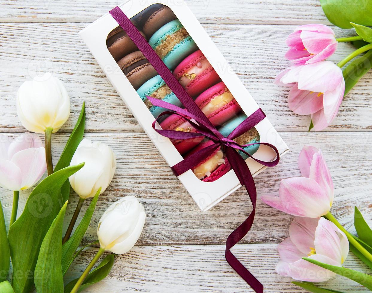 Colorful macaroons and tulips photo