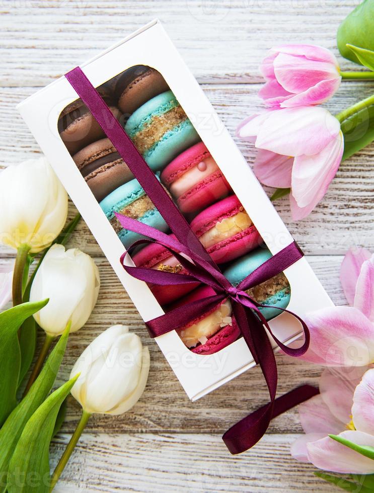 Colorful macaroons and tulips photo