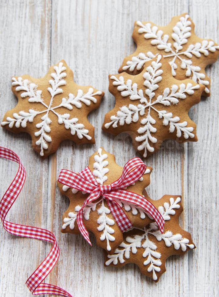 Christmas gingerbread cookies on white wooden background photo