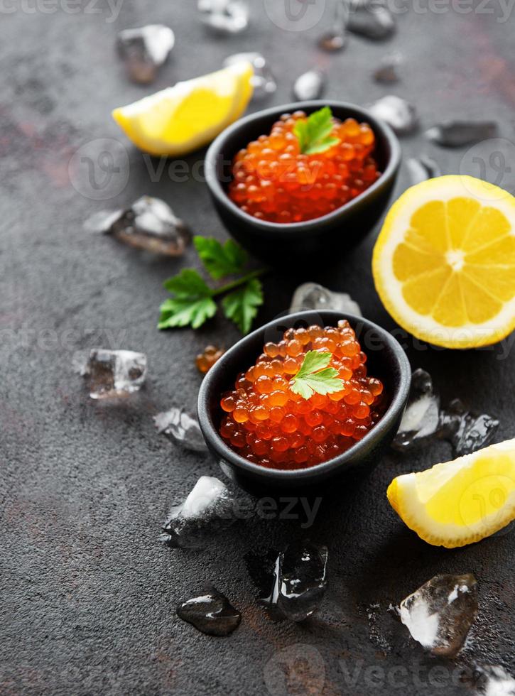 Red caviar in bowls photo