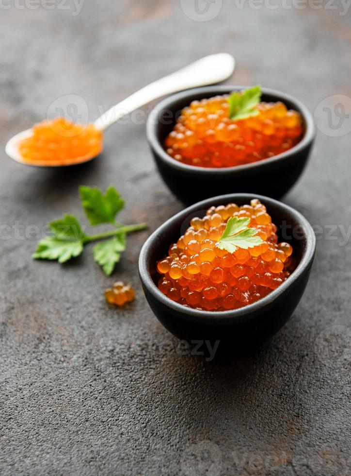 Red caviar in bowls photo