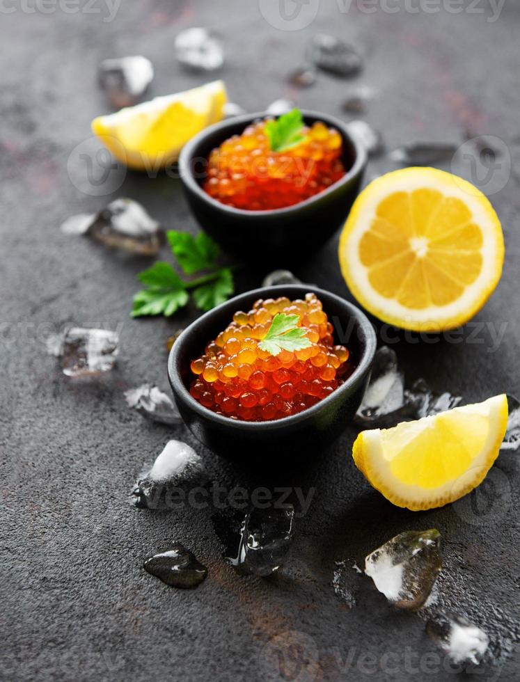 Red caviar in bowls photo