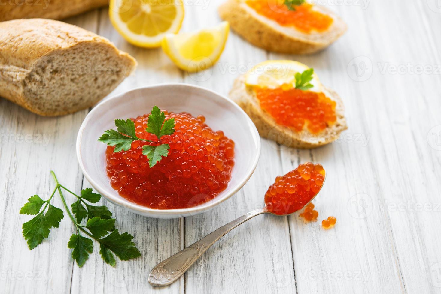 Red caviar in bowl photo