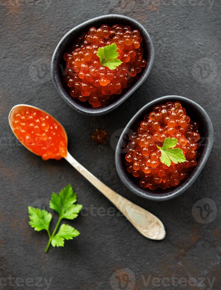 Red caviar in bowls photo