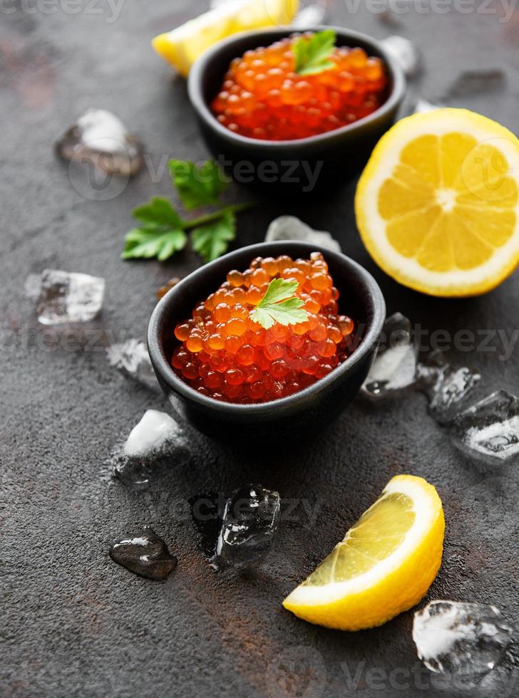 Red caviar in bowls photo