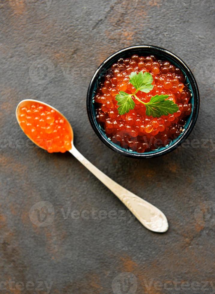 Red caviar in bowl photo