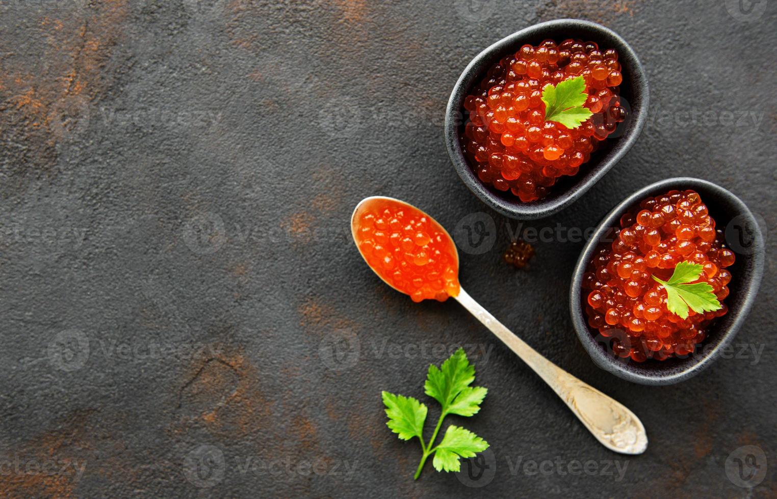 Red caviar in bowls photo