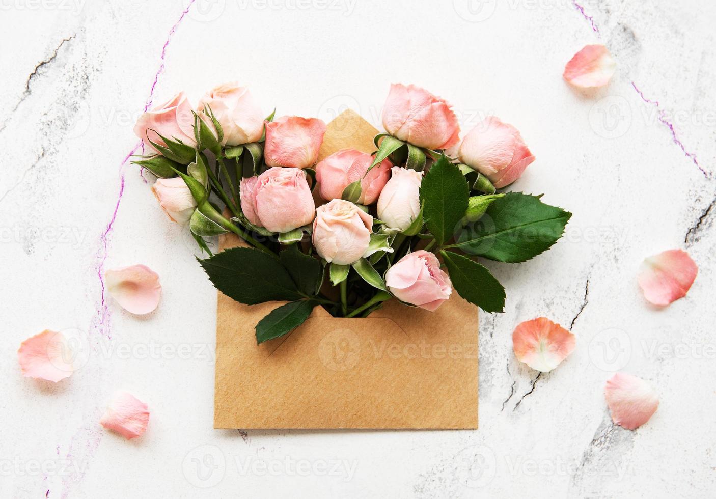 Envelope and pink roses photo