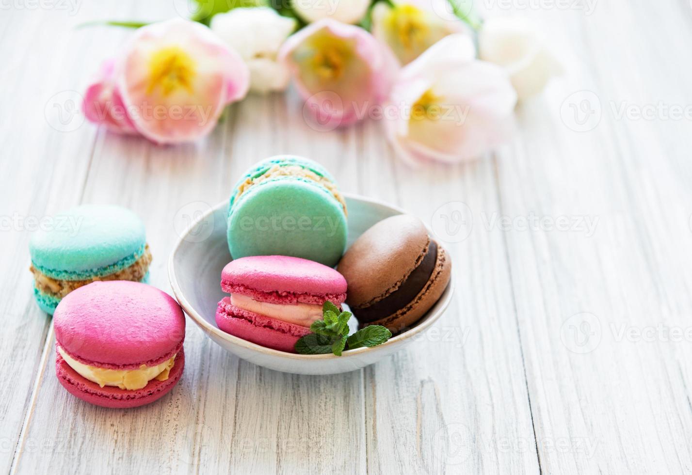 Colorful macaroons and tulips photo