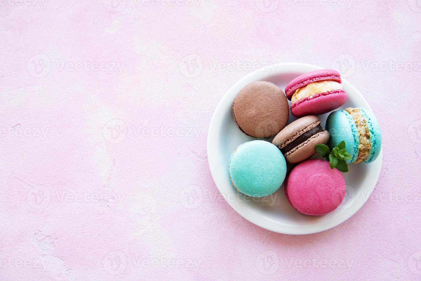 Colorful macaroons and mint photo