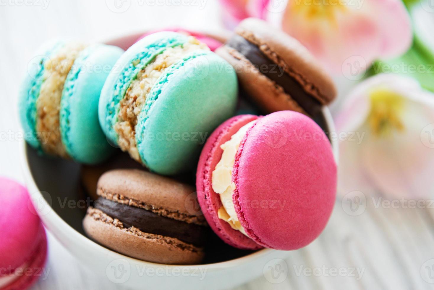 Colorful macaroons and tulips photo