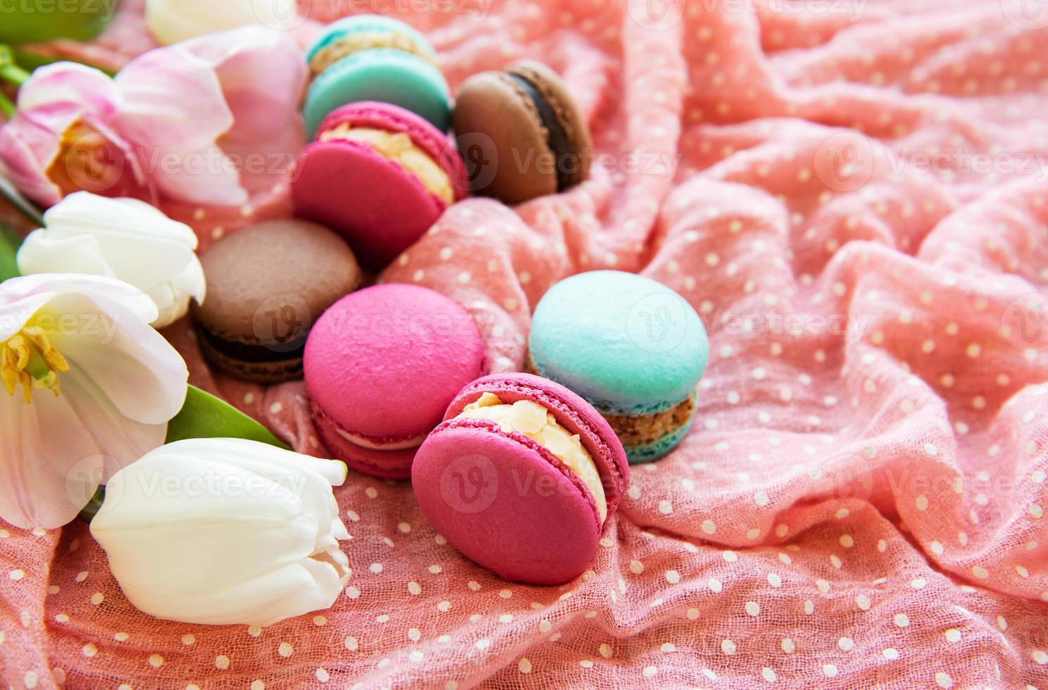 Colorful macaroons and tulips photo