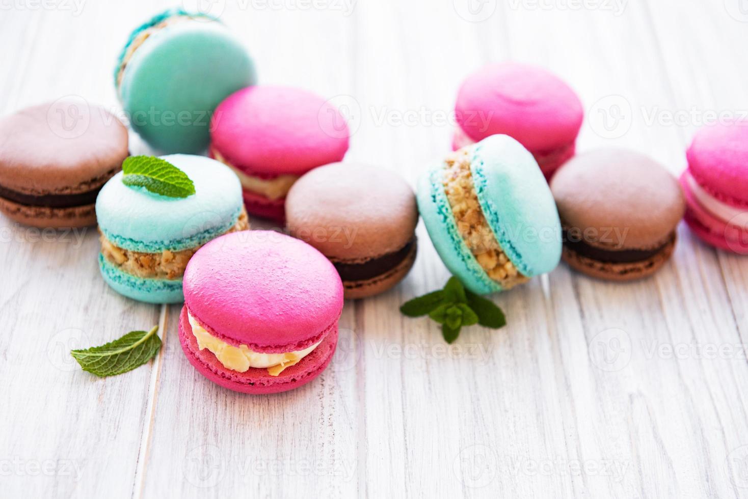 Colorful macaroons on a table photo