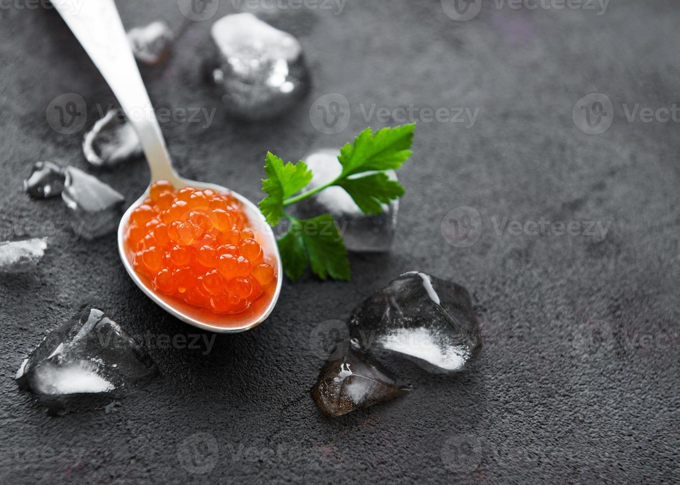 Spoon with delicious red caviars photo