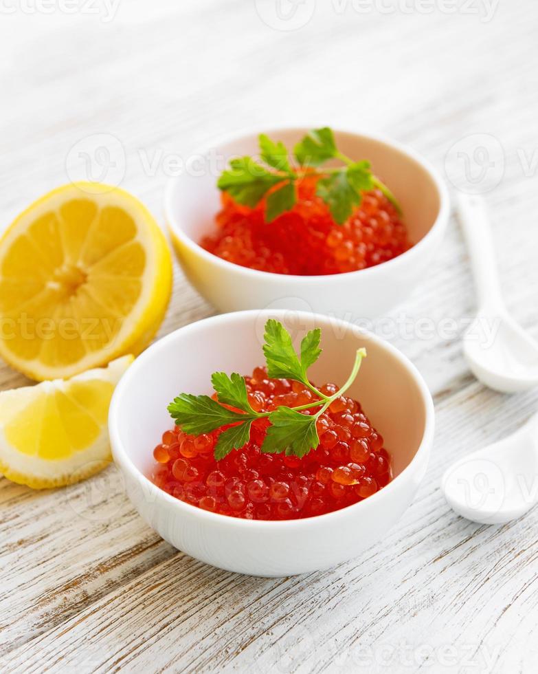 Red caviar in bowls photo