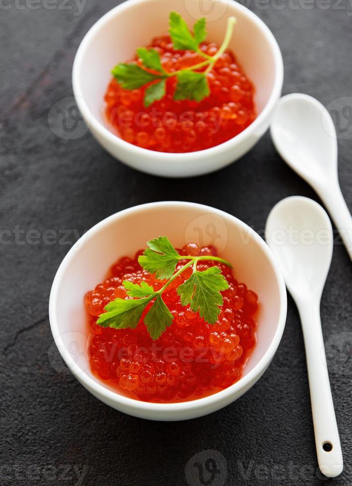 Red caviar in bowls photo